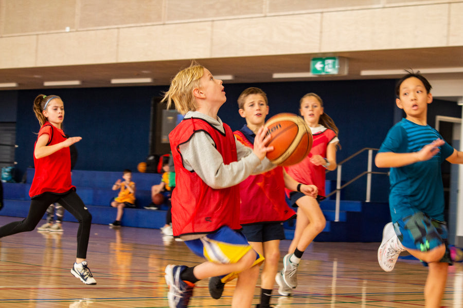 Match play at an ASC children's Basketball Camp.