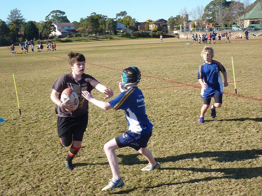 Kids practising Rugby Union fending skills at ASC