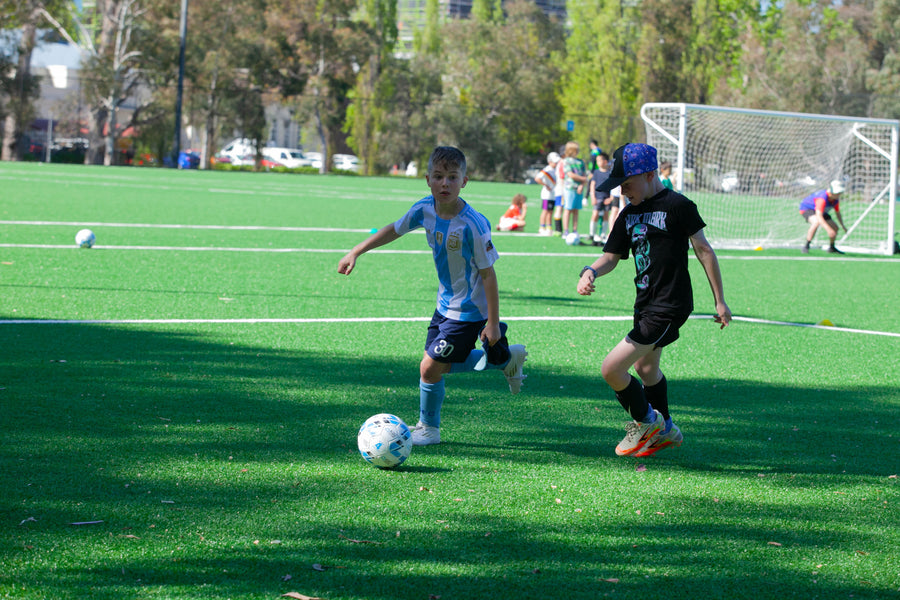 Children practising soccer skills