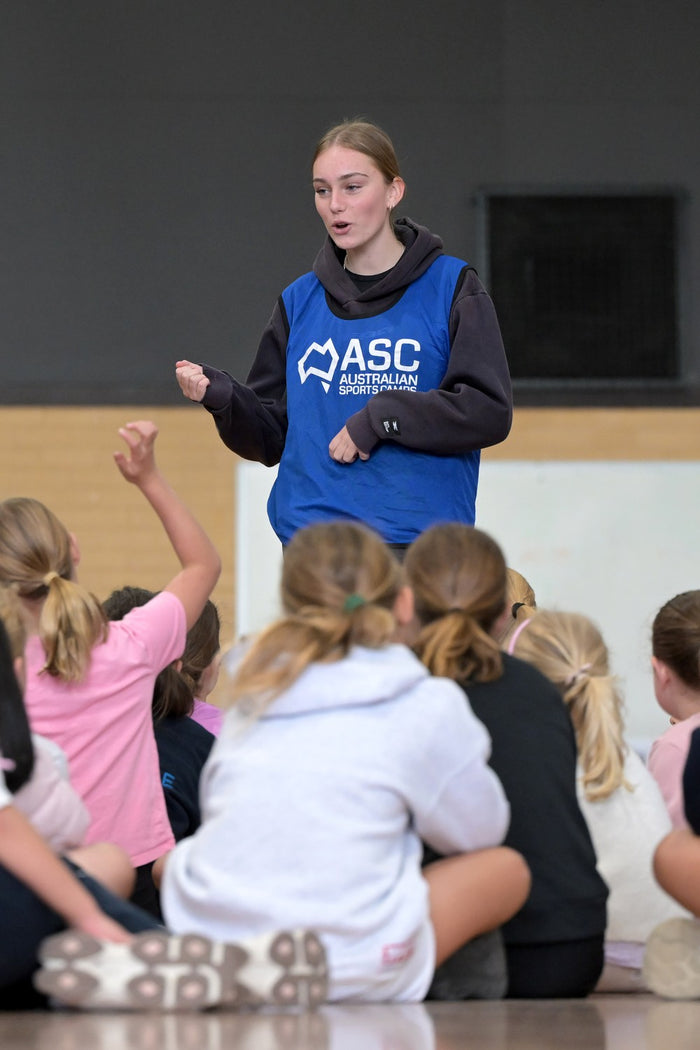 Coach taking a Q & A session during an ASC netball program