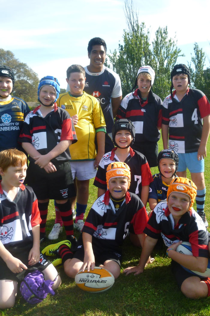 A group of happy children at an Australian Sports Camps rugby union camp