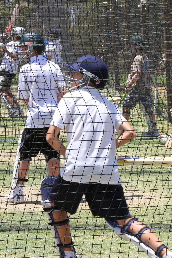 Group of boys practising their batting skills at an ASC cricket camp