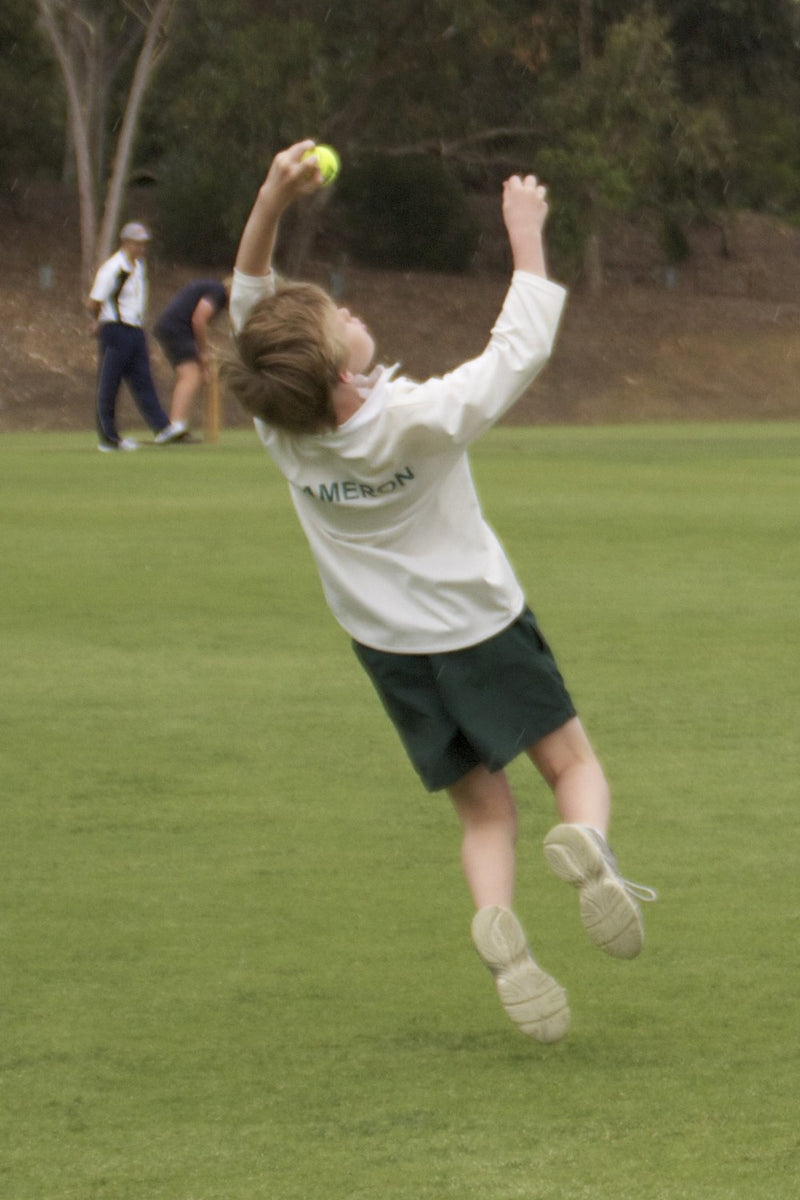 Young boy taking a one handed catch at an ASC cricket camp