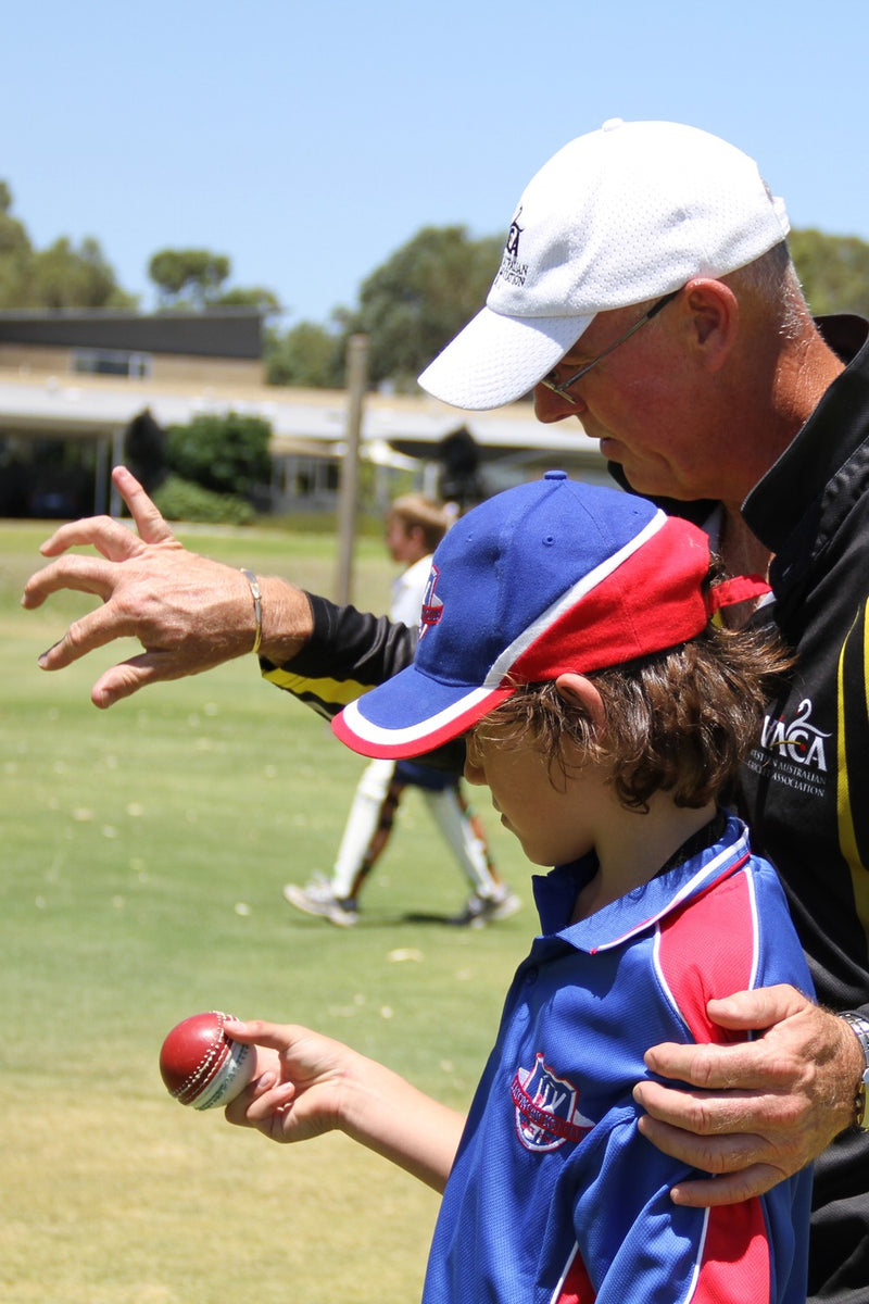 Experienced coach providing spin bowling tuition at an ASC cricket camp