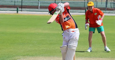 Youth batting at an ASC cricket camp