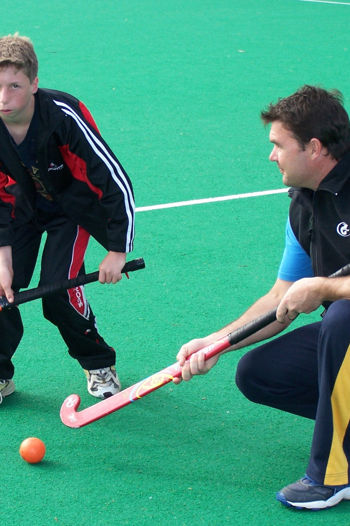 Young boy receiving hockey coaching at an ASC hockey camp