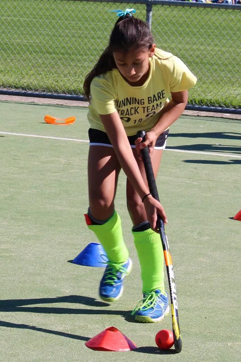 Young girl honing her dribbling skills at an ASC field hockey camp