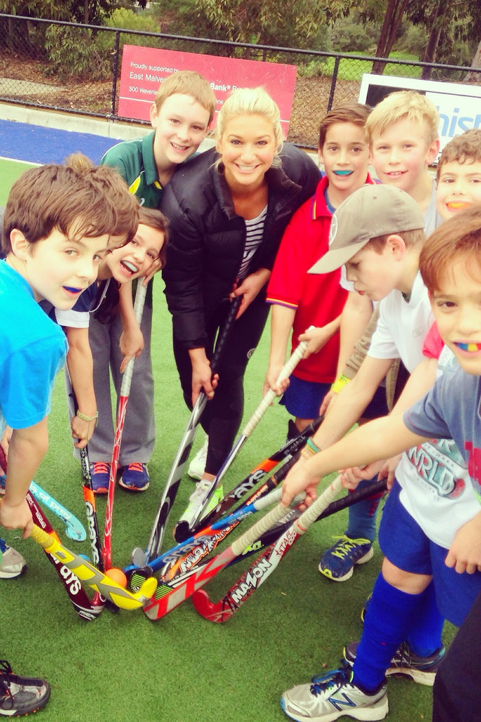 Group of happy kids at an ASC hockey camp
