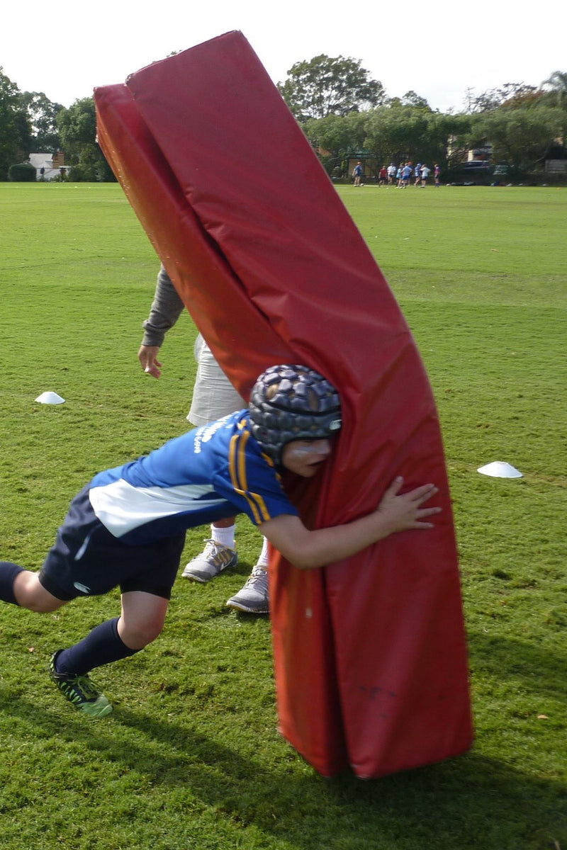Young boy during tackling practise at an ASC rugby union camp