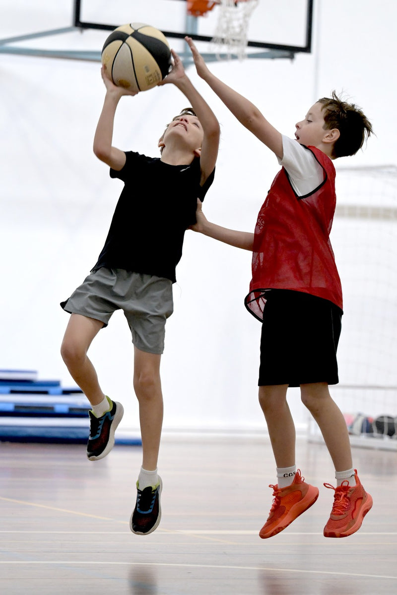 Two young participants showing what to expect an an ASC basketball camp